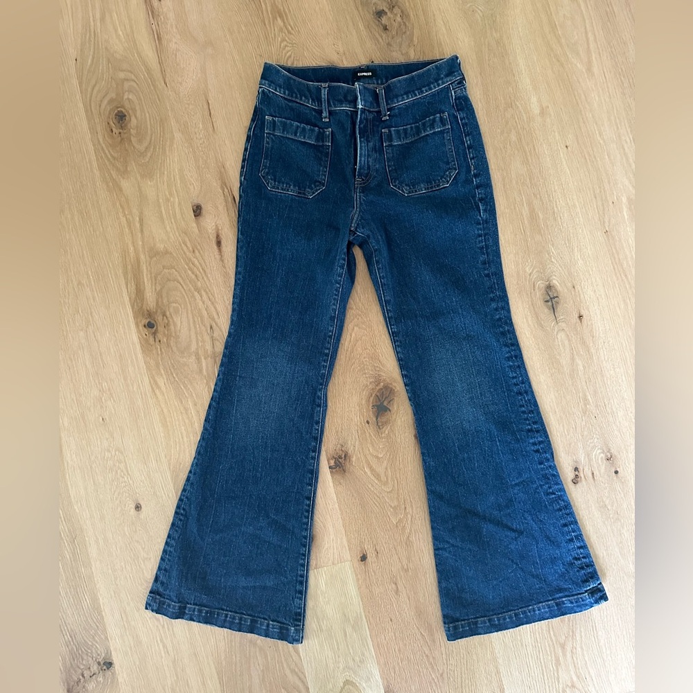 Express flare high waisted jeans with bucket pockets in front. Conscious edit.